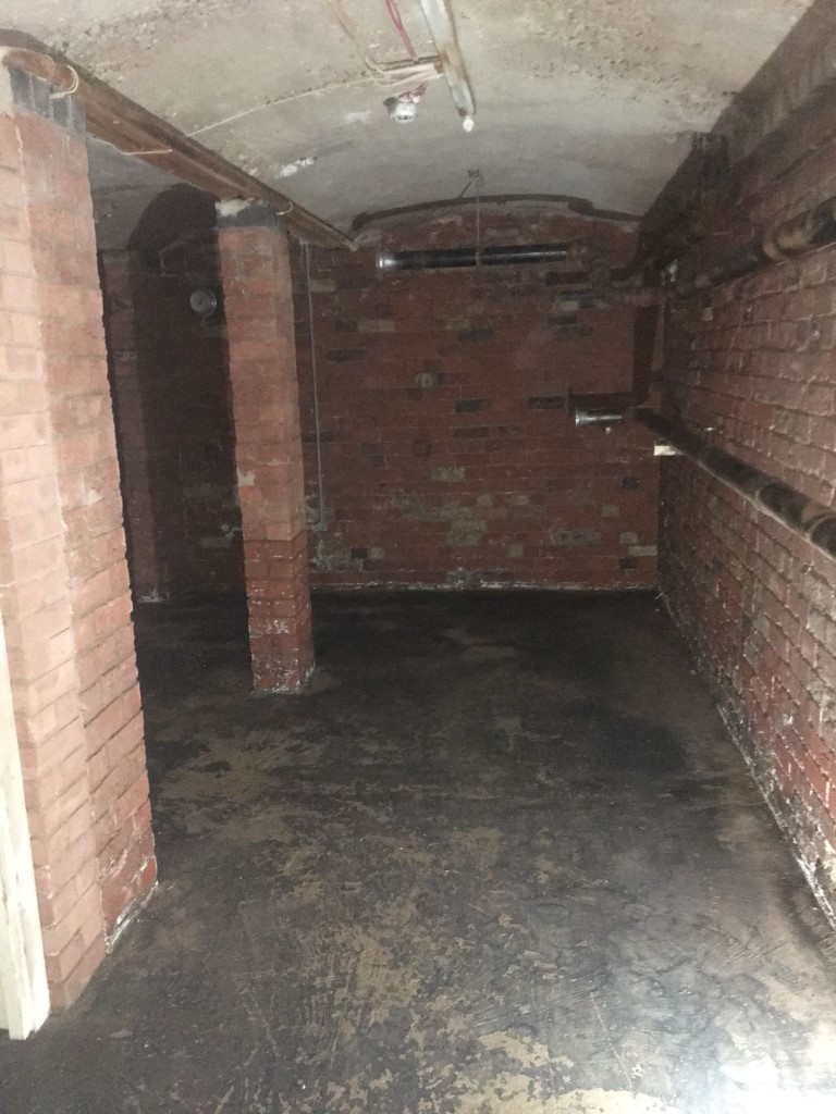 Inside of a building with asbestos residue on the walls