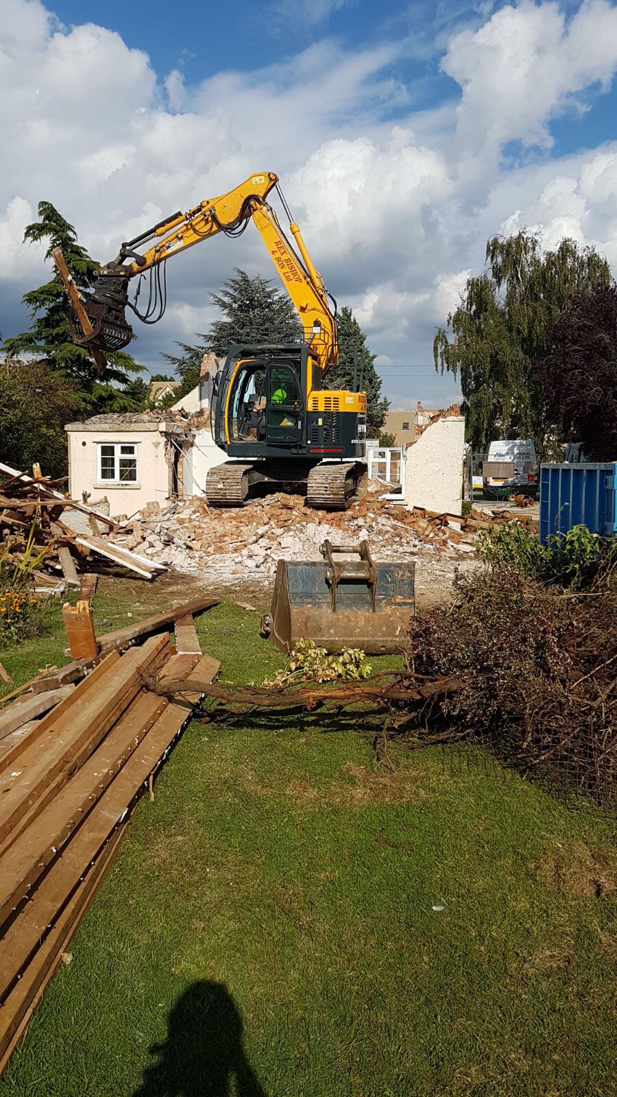 Digger on a pile of rubble