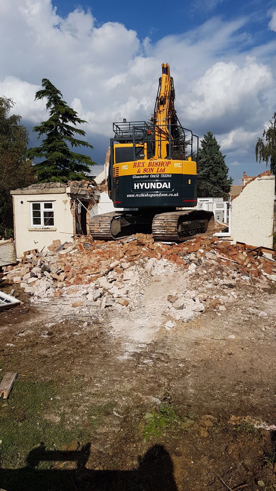 Digger on a pile of rubble