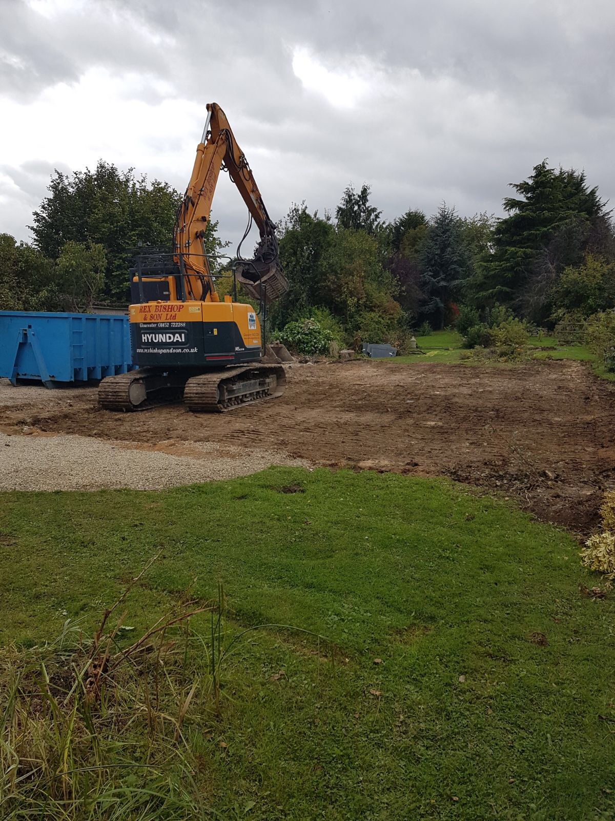 Digger on open grass