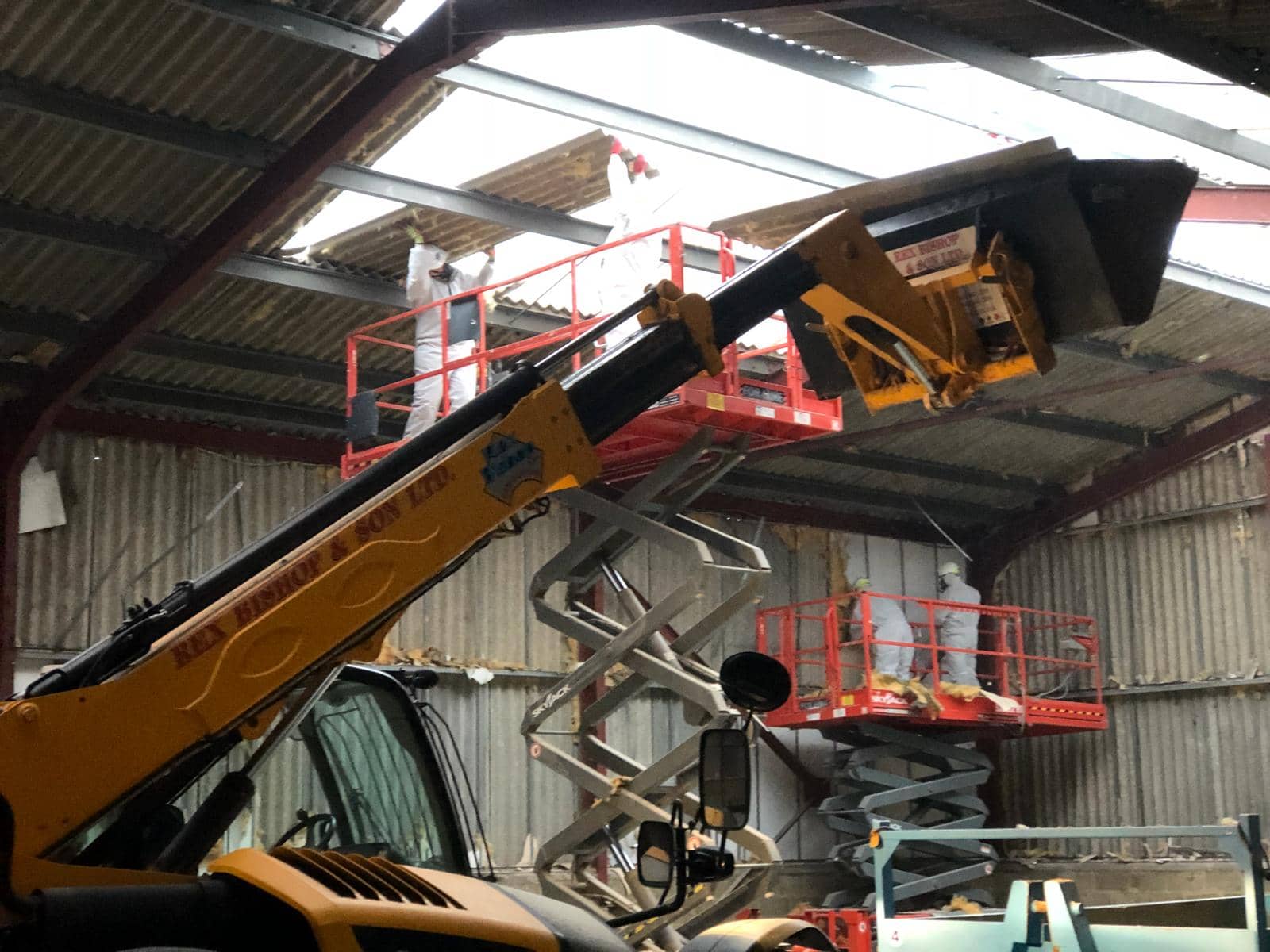 Worker getting lifted by machinery