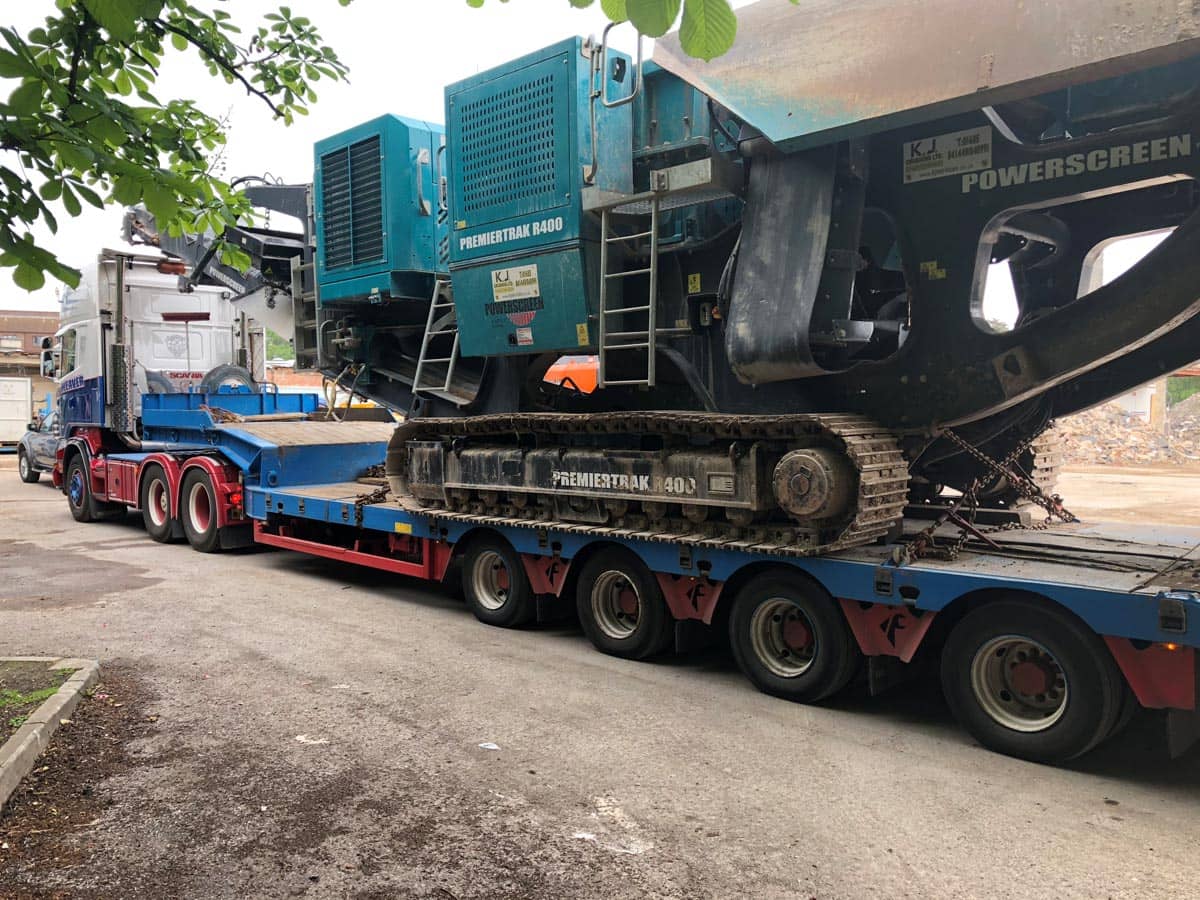 Container being carried on the back of a truck